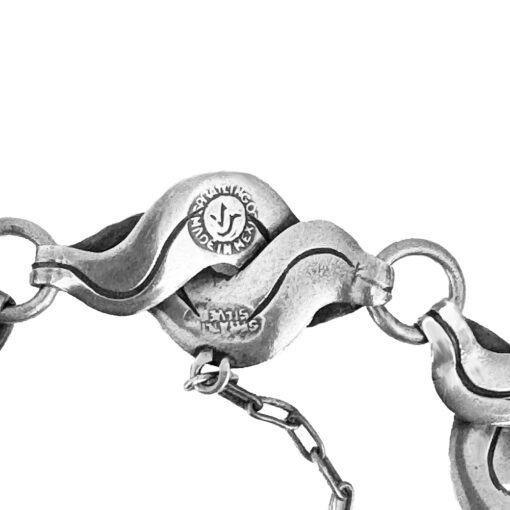 Silver wavy chain link with engraved text.